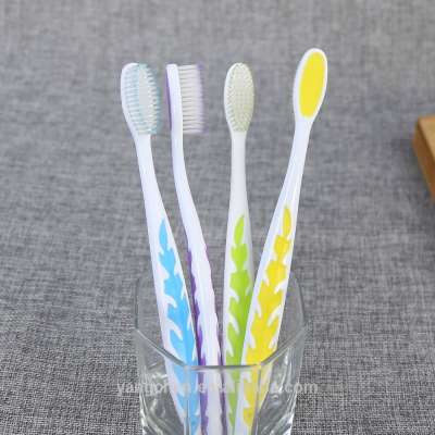 best selling adult toothbrush with colorful leaves image on handle from factory teeth brush